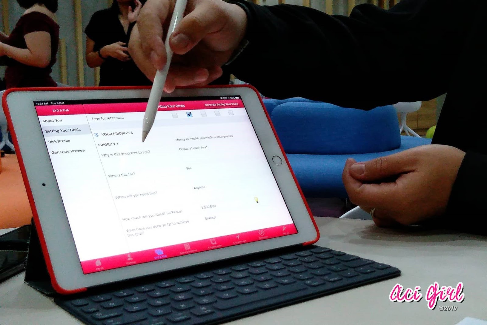 A financial advisor uses the iPoS app on an iPad to set a client’s goals and priorities.